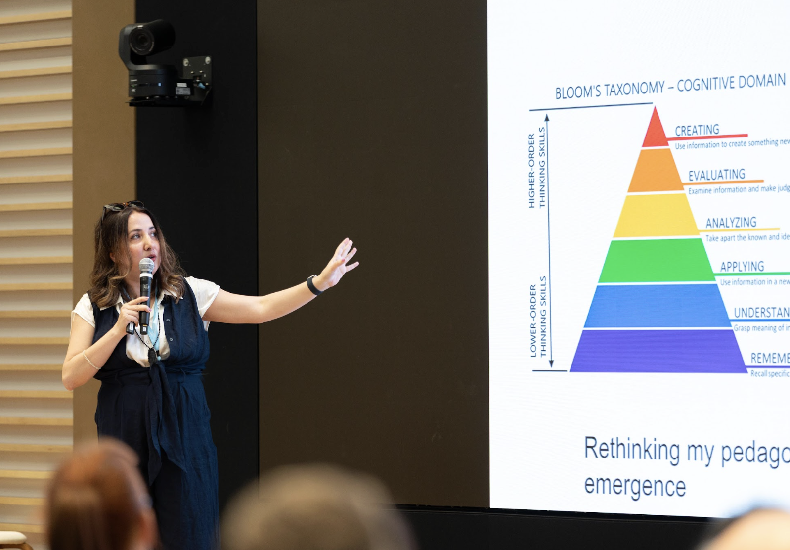 Tina Austin discussing learning and assessment during a presentation